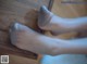 A woman's feet in a pair of gray socks.