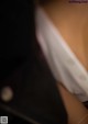 A close up of a person wearing a white shirt.